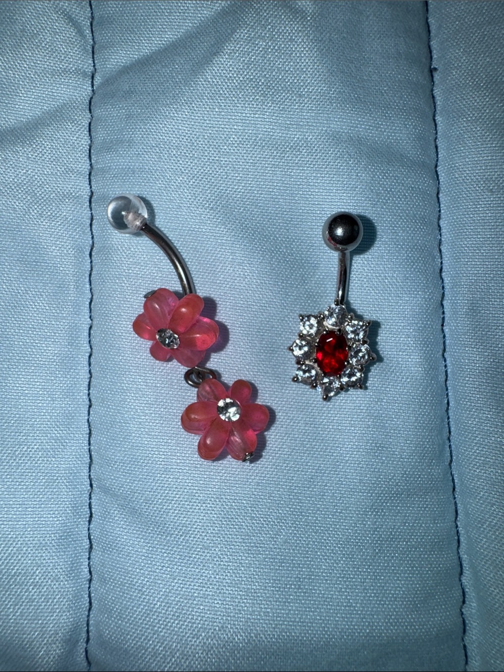 2 Navel Rings.  Double pink floral  and deep red with crystals.